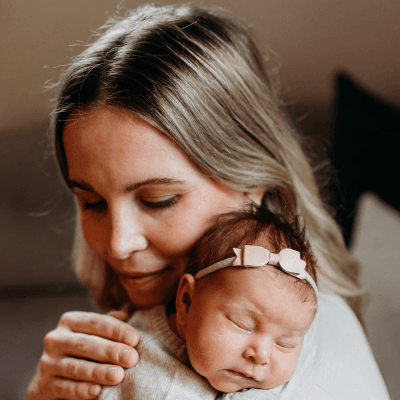 Jennifer Little holding a baby